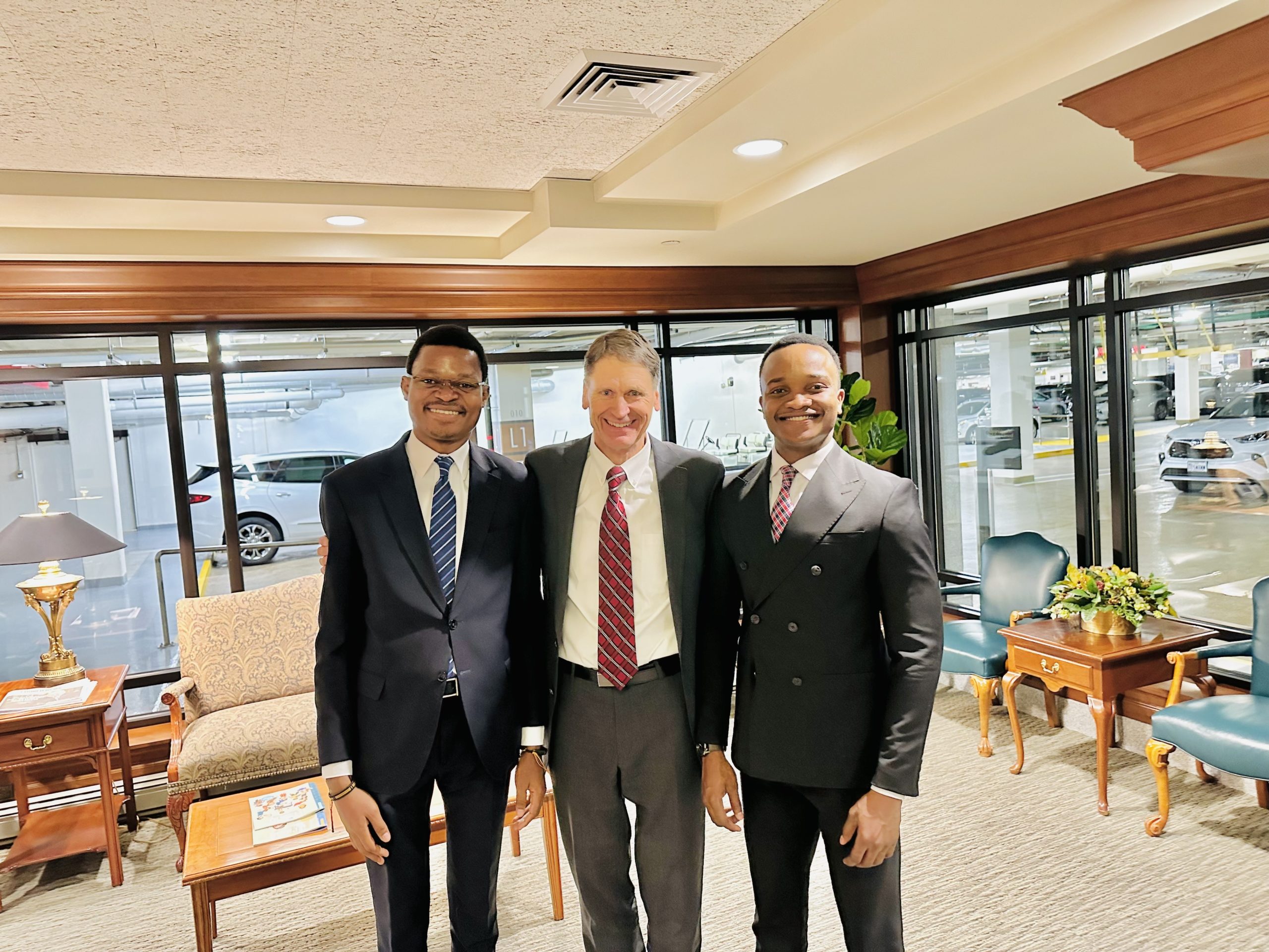 David Muanda and Lievin Kasaka meeting Carl B. Cook in Salt Lake City, Utah