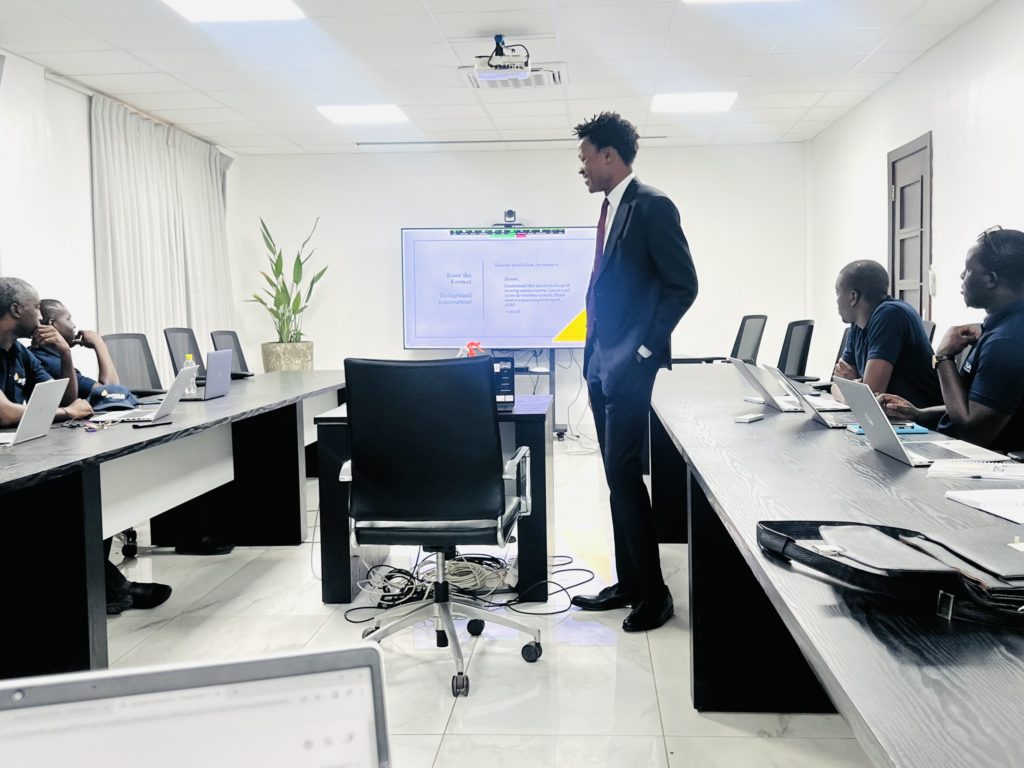 David Muanda leading a meeting at AMSA Assurances HQs in Dakar, Sénégal