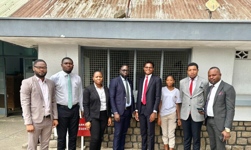 Family picture: David Muanda, CEO of Friendina College, met with EquityBCDC staff in Kananga, the Democratic Republic of the Congo