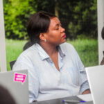 Mamie Carole Kalond attending the meeting at Baobab RDC being conducted by David Muanda, CEO at Friendina College
